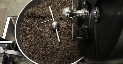 Roasting Coffee Beans Whirling Mixed On Cooling Unit Platform In A Manufactory Stock Footage 77374344