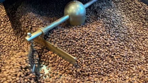 Roasting of coffee seeds. Grinding coffee beans in the machine close-up. Cooking Stock Footage 207568960