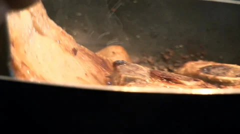 Roasting a cutlet in a frying pan Stock Footage 34657029