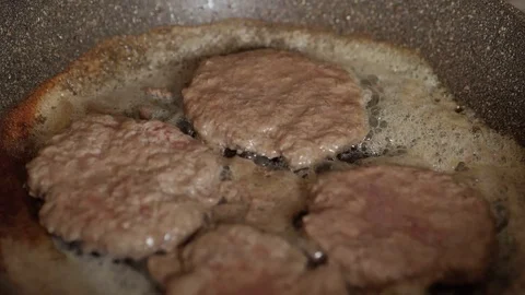 Roasting cutlets turn in pan Video stock 75011771