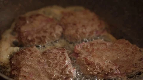 Roasting cutlets turn in pan Stock Footage 75012206
