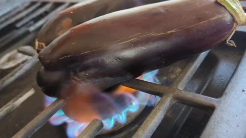 Roasting Eggplants on Stove Top Stock Footage 314586613