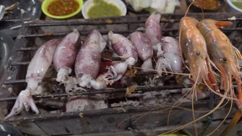 Roasting fresh seafood Stock Footage 257474525