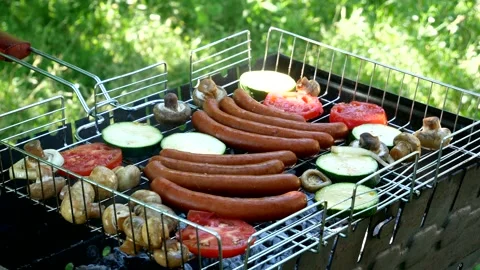Roasting on the grill. The cook puts champignon mushrooms on the grill. Fried Stock Footage 202218332
