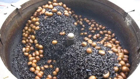 Roasting machine with chestnuts, slow motion Stock Footage 85956446