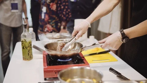 Roasting marinated beef in a frying pan Stock Footage 120490923