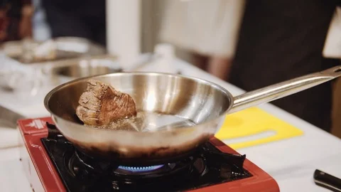 Roasting marinated beef in a frying pan Video stock 120491078