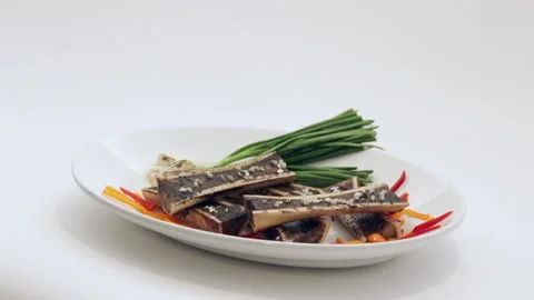 Roasting marrow in white background Stock Footage 138411547
