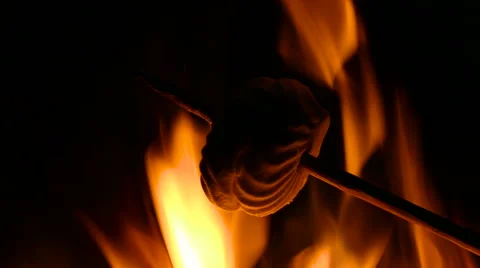 Roasting marshmallow on fire. Burning marshmallow. Stock Footage 68979104