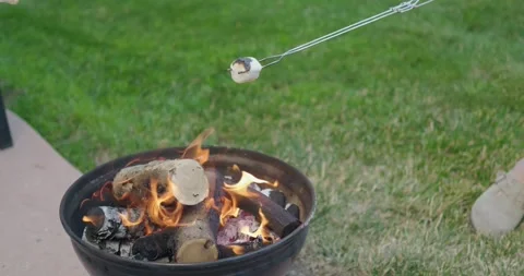 Roasting Marshmallow Over Backyard Fire Pit Flames Stock Footage 333074789