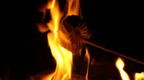 Roasting marshmallow on the stick. Slow motion. Stock Footage 68978877
