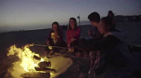 Roasting marshmallows and taking pictures Stock Footage 53497142