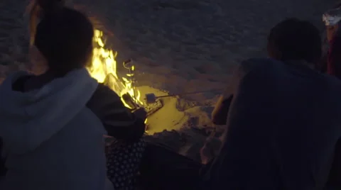 Roasting marshmallows at the beach Stock Footage 53495758