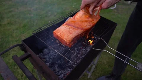 Roasting meat on the grill. Cooking ribs on the grill Stock Footage 306009548