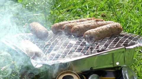 Roasting meat on a home barbeque Stock Footage 56965479