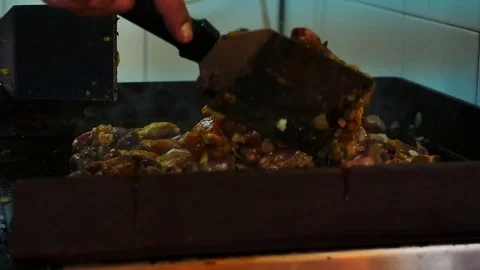Roasting meat slices on a hot plate Stock Footage 77361389