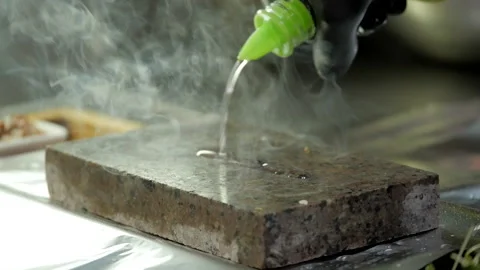 Roasting Meat on a Stone Stock Footage 132106788