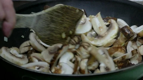 Roasting mushrooms, slow motion, 4k Stock Footage 63301097
