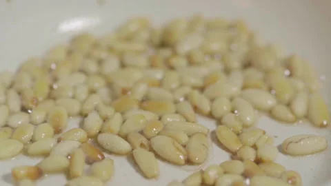 Roasting pine nuts Stock Footage 141099093