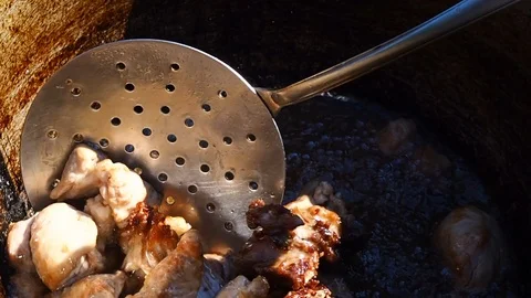 Roasting rabbit meat in a large pot Stock Footage 110793604