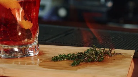 Roasting of rosemary for a cocktail Stock Footage 76951959
