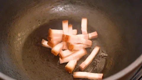 Roasting of salted pork fatback on a red-hot pan, close-up Stock Footage 248906055