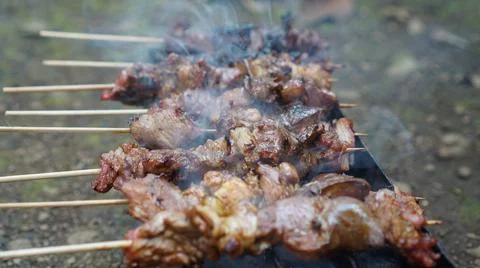 Roasting satay on the grill Foto stock