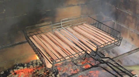 Roasting sausages on fire Stock Footage 24241237