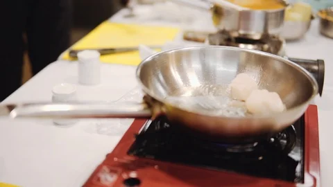 Roasting scallops in a frying pan Stock Footage 120486477
