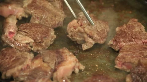 Roasting sliced beef on hot pan Stock Footage 46032893