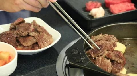 Roasting sliced beef on hot pan Stock Footage 46032930
