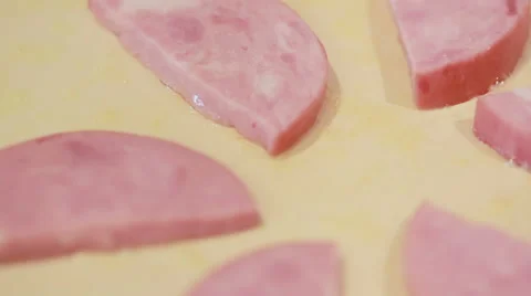Roasting slices of sausage. preparing breakfast. burning meat Stock Footage