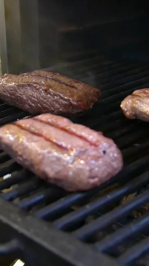 Roasting steak in a restaurant. Vertical video. Stock Footage 290217140