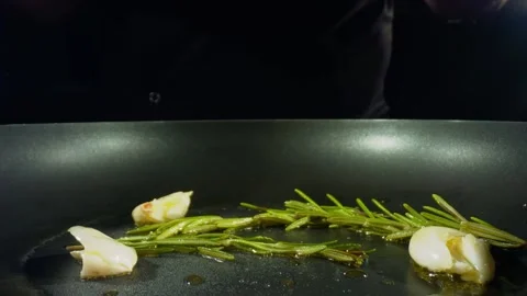 Roasting steaks on frying pan at kitchen, closeup view of cooking process. Shot Stock Footage 137318114