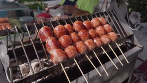 Roasting Thai Northeastern sausages 動画素材 257469657