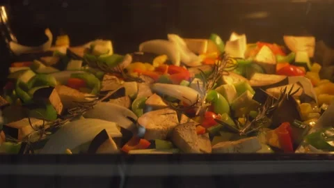 Roasting vegetables in the oven - 4K timelapse Stock Footage 140540221