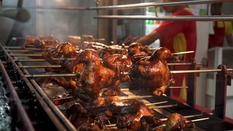 Roasting Whole Chickens on Charcoal while Man Removing Rod Video stock 88403241