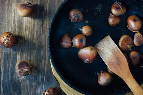 Roated chestnuts on pan Stock Photos