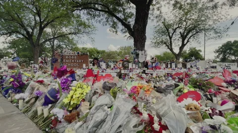 Robb Elementary School In Uvalde, Texas-Brick Sign With Crosses Stock Footage 196615397
