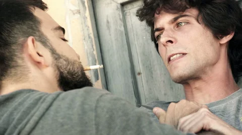 Robber attacks a young boy with a gun Stock Footage 68550260