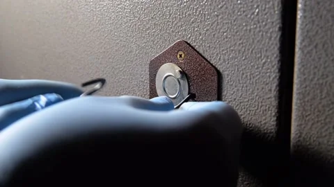 A robber breaks the lock of a safe or door Stock-Footage 151696324