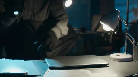 Robber Checking Documents with Flashlight on Office Desk, Stealing Laptop Vídeos de archivo 321676400