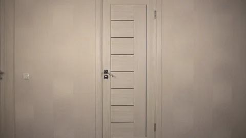 The robber climbed into the house. The masked bandit carefully entered through Stock Footage 123735705