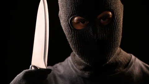 The robber hold the knife in hand Stock Footage 129585342