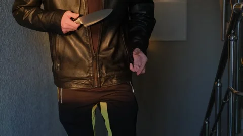 Robber with knife climbs stairs to attack Stock Footage 276193106