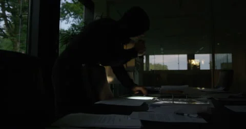 Robber Looking For Something And Than Running Away Stock Footage 146130922