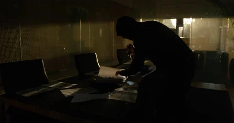 Robber Looking Through Legal Papers Stock Footage 146132270