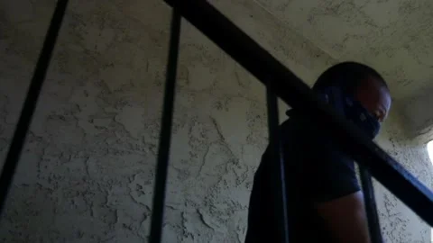 Robber running down stairs Stock Footage 273258785