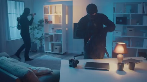 Robbers Broke Into House Puts Everything in Backpack, Take TV, Safe Stock Footage 239885023