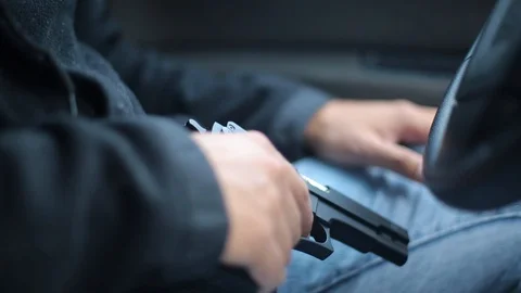 Robbery, man get out of car ready for assault Stock Footage 129846374